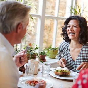 People eating lunch while wearing dental implants